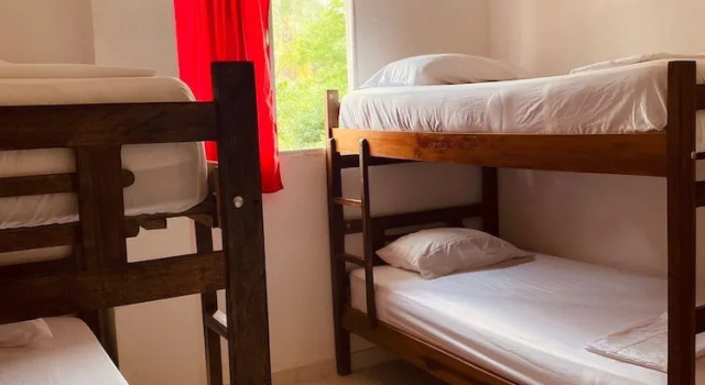 Кровать в общем номере Casa Guiwa Hostel