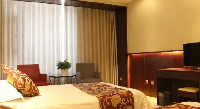 Orchid Hotel (Wangyuan Sijixian Wholesale Market Branch)
