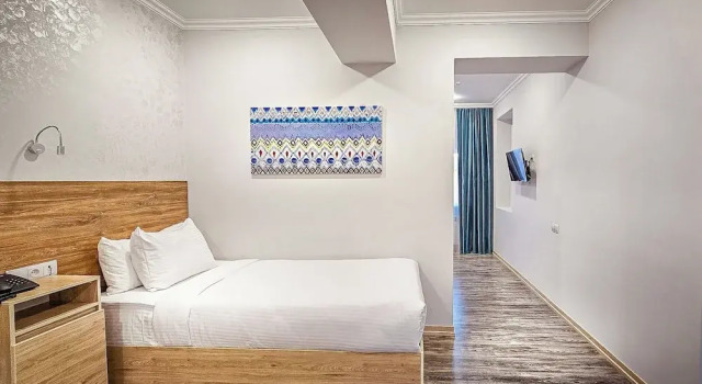 Четырёхместный семейный номер Standard с балконом и с видом на внутренний двор Hotel Bankir Khiva