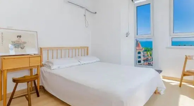 Люкс с 2 комнатами с видом на море Yijia B&B (Qingdao Jinshatan Branch)