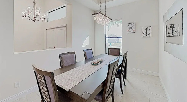 Impeccable Canal-front W/ Lanai & Caged Pool 4 Bedroom Home