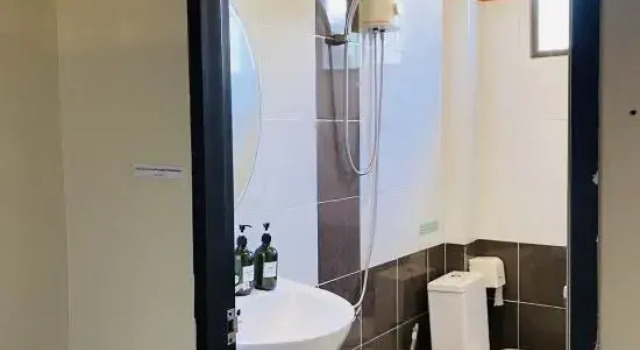 Кровать в общем номере Beach House 24