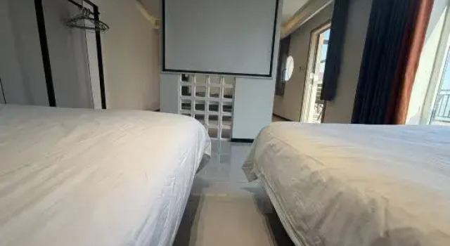 Люкс с 2 комнатами с красивым видом из окна Lianyungang One Step Away Seaview Homestay