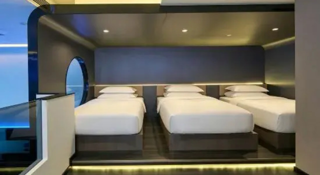 Кровать в общем номере Guangyin Guest House