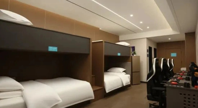 Кровать в общем номере Ai E-sports Hotel IDJ · Keke West Road, Yushu