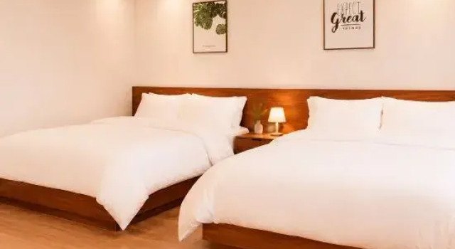 Кровать в общем номере Yuanju Homestay