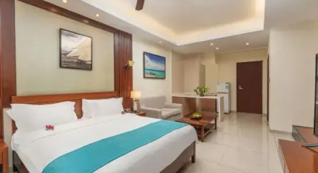 Кровать в общем номере Paxton Vacances Hotel & Suite Sanya