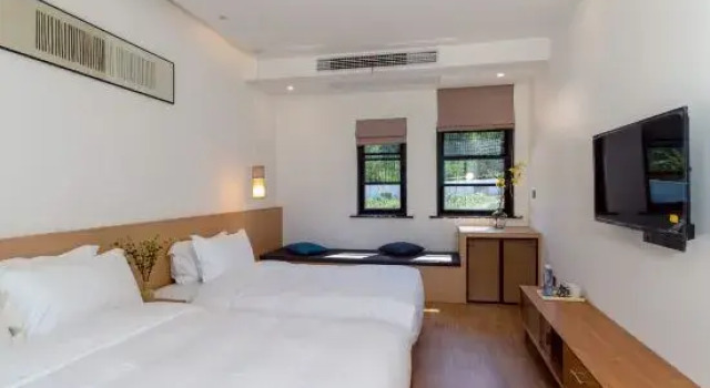 Кровать в общем номере Moganshan Chaoyan Homestay