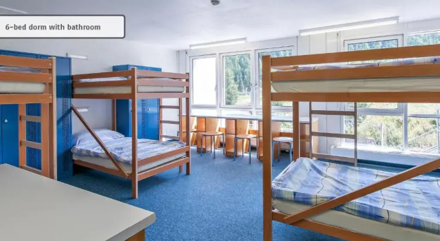 Кровать в общем номере с красивым видом из окна All In One Hotel - Inn Lodge / Swiss Lodge