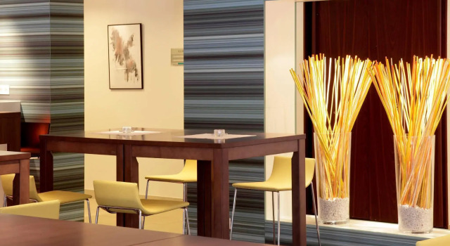 Кровать в общем номере Ibis Styles Linz