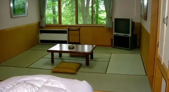 Кровать в общем номере Pension Kinoshita