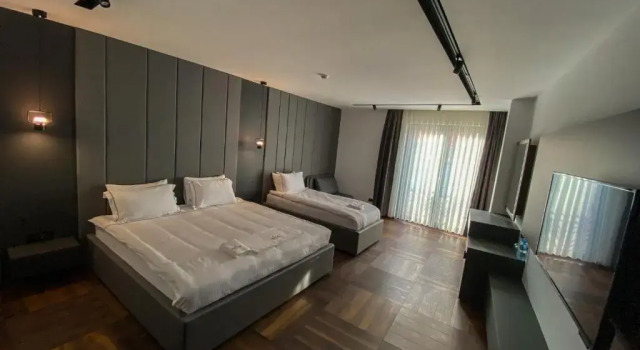 Четырёхместный номер Deluxe Triumf Hotel