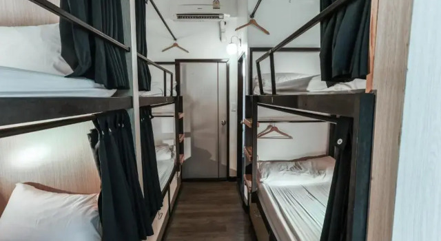 Кровать в общем номере Connect Hotel Chiang Rai