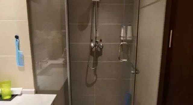 Кровать в общем номере с красивым видом из окна Yabuli Lucheng Snow View Apartment