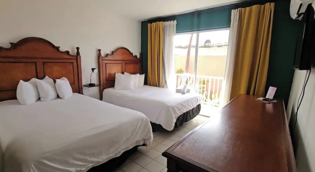 Четырёхместный номер Deluxe с балконом и с видом на сад Selva Boutique Hotel - Luquillo Oceanfront Retreat - Adults only