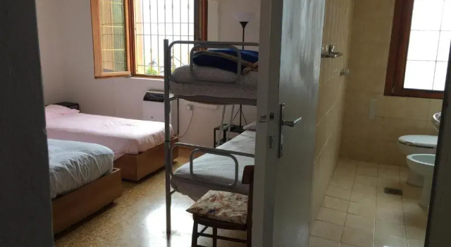 Bett im Wohnheim Ostello Trentapassi