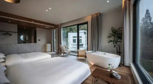 Кровать в общем номере Qingshanli Wentang SHAN Limei Villa