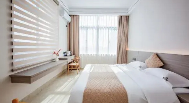 Двухместный семейный люкс с балконом Meizhoudao Zhaoxi Chaoxi Homestay (Lianchiao Shatan Beach)