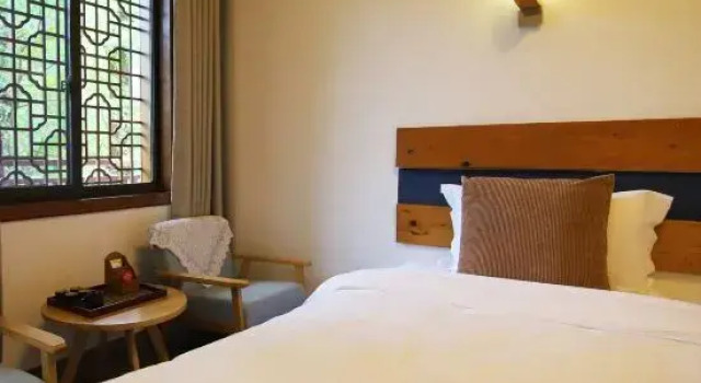 Кровать в общем номере Banjianwu Hostel