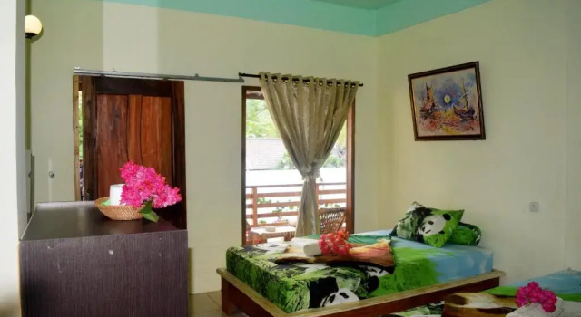 Кровать в общем номере Panda Cottage