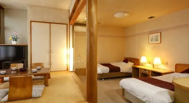 Кровать в общем номере Ryokan Nadeshiko no Yu