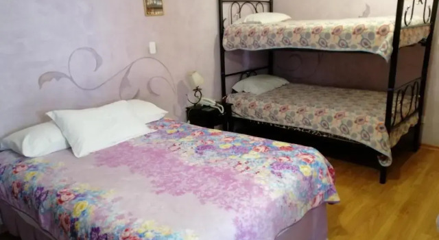 Pat în dormitor Latacunga Hostel