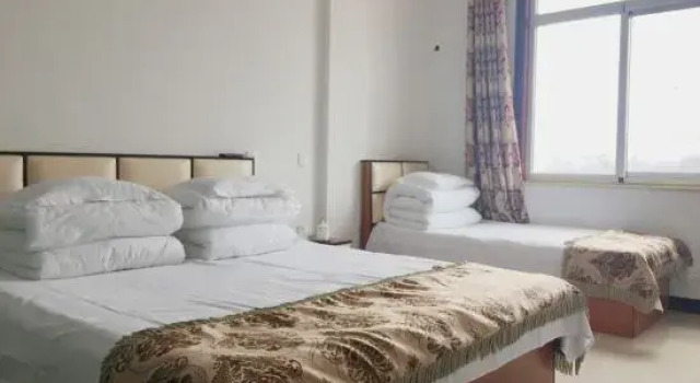 Кровать в общем номере Tianjin Fuchun Farm stay