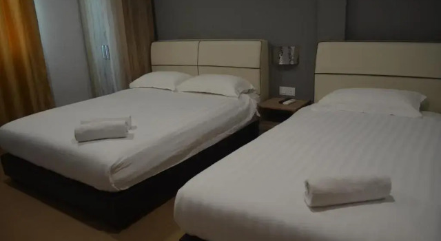 Четырёхместный номер Deluxe с красивым видом из окна Welcome Inn GM