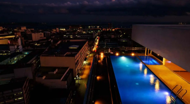 Кровать в общем номере One Central Hotel & Suites