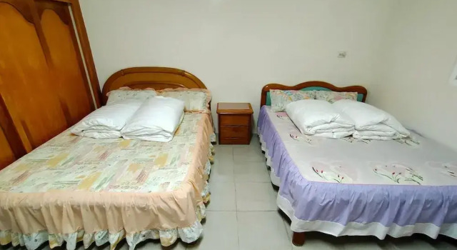 Кровать в общем номере Hai Xia Your Home