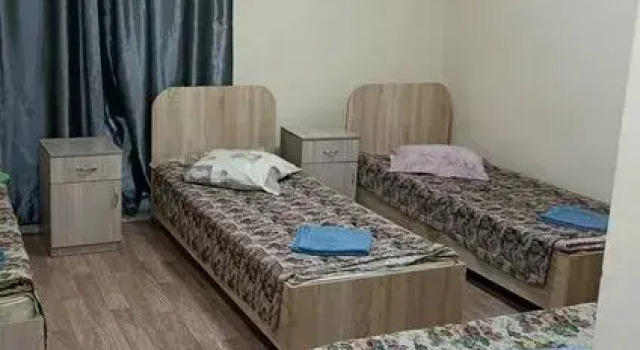 Кровать в общем номере Мини-отель Тихий дворик