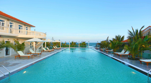 Кровать в общем номере Saigon Emerald Beach Resort