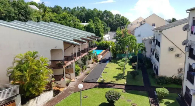 Апартаменты Appartement DUPLEX LAGON BLEU ac Piscine Bas du Fort
