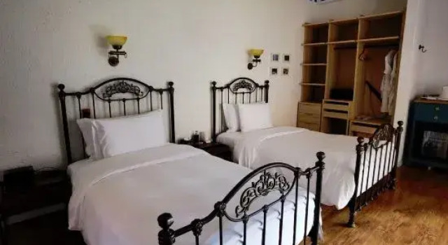 Кровать в общем номере с видом на море Baima Holiday Qingshe Seaview Manor