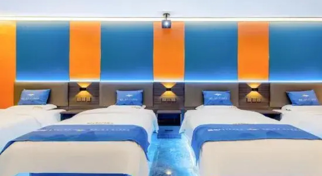 Кровать в общем номере PIKA Electronics Competition Hotel