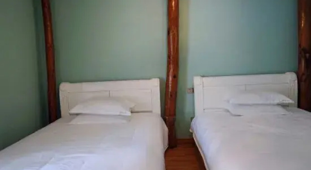 Кровать в общем номере Yunshang Shenchu Homestay