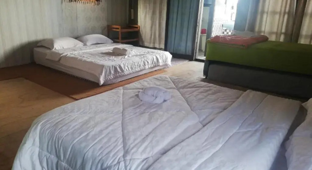 Кровать в общем номере Smiley's Homestay