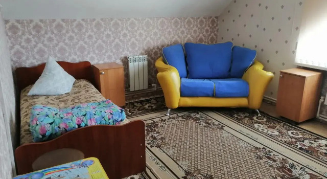 Кровать в общем номере Дом на Рябиновой
