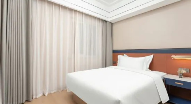 Люкс Business с 2 комнатами Meihao EZZI Hotel (Jinan Olympic Sports Center Wanxiangcheng)