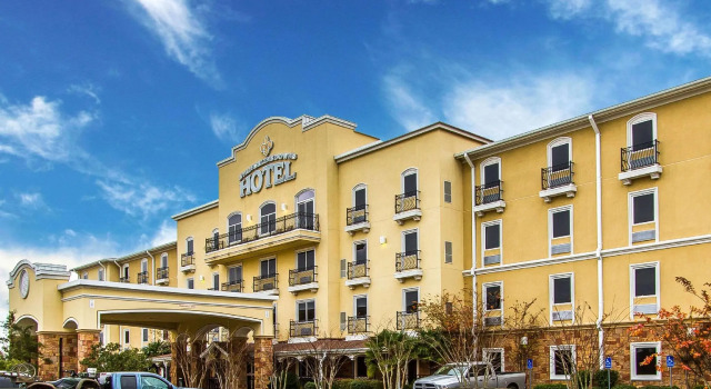 Кровать в общем номере Evangeline Downs Hotel, an Ascend Collection Hotel