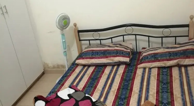 Кровать в общем номере Blessing Homes