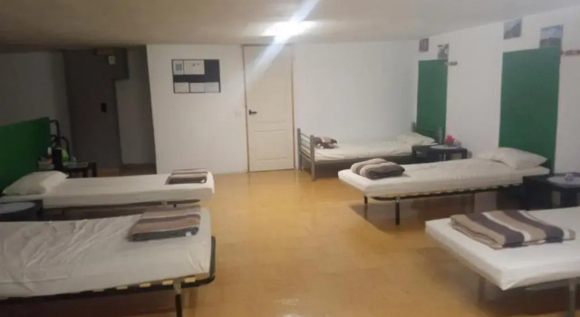 Кровать в общем номере Albergue El Peregrino