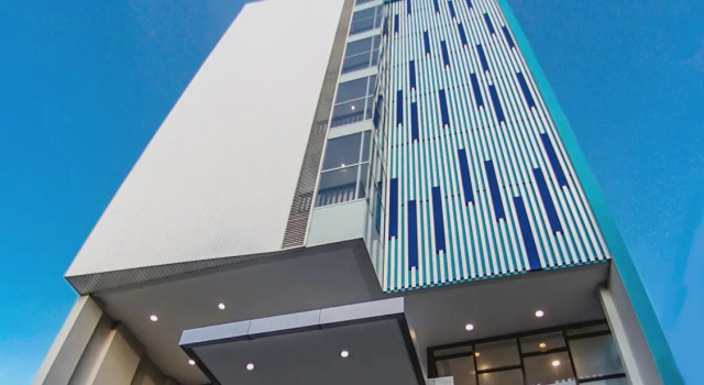Кровать в общем номере Genio Hotel Manado