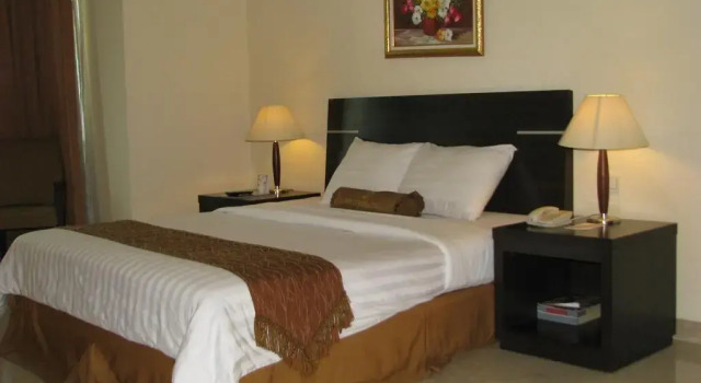 Номер Deluxe Grand Asia Hotel Jakarta