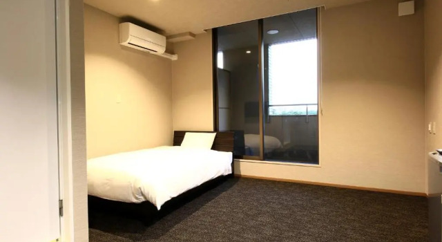 Номер Deluxe KANEMITSU CAPITAL HOTEL