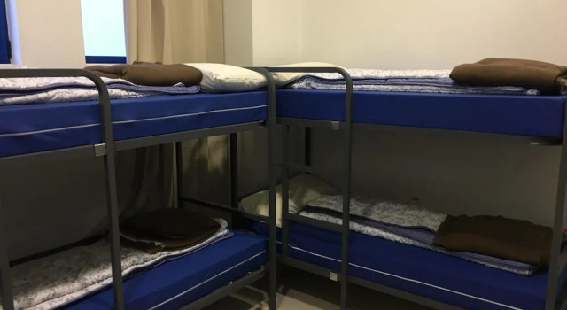 Кровать в общем номере Hostel de las Facultades