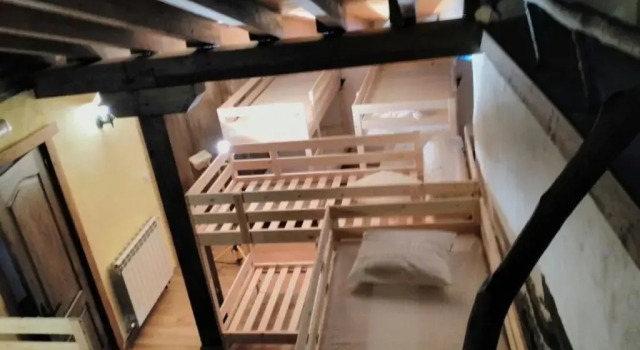Кровать в общем номере Albergue De Soba