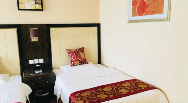Кровать в общем номере Shijiazhuang Yihai Holiday Hotel