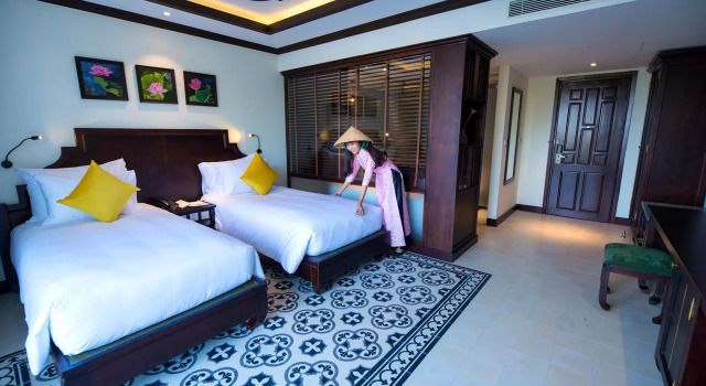 Номер Premier с балконом Grand Signature Resort Hoi An by M Village, a brand of Modern Village Lifestyle