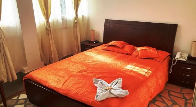 Кровать в общем номере Hotel Andino Real